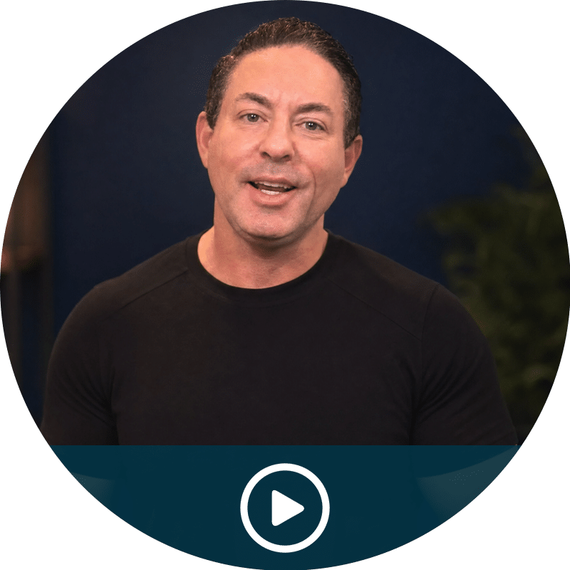 Video thumbnail: man in a black shirt speaking, circular frame with a play button overlay.