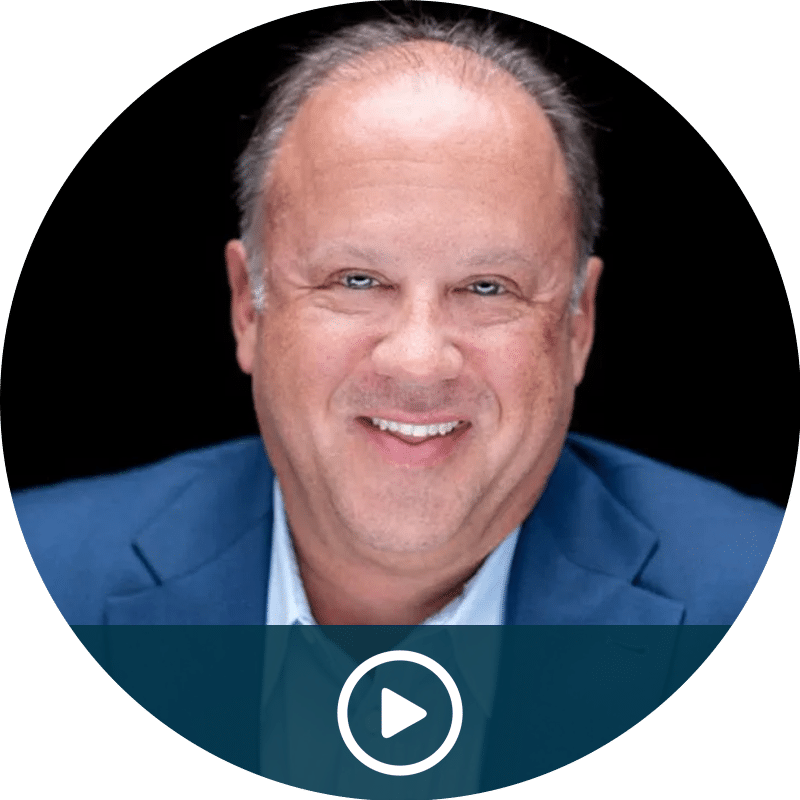 Video thumbnail of a smiling man in a blue blazer against a black background.